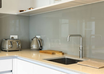 Penman Interiors Chelsea Kitchens Grey Glass Splashback Modern White Styling