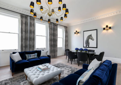 Penman Interiors Chelsea Living Rooms Blue Cobalt Sofas Black Gold Shade Lighting Grey Curtains Horse Art Styling