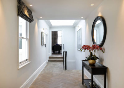 Penman Interiors Hallways Oak Herringbone Flooring Black Furniture Staircase Styling Round Mirror